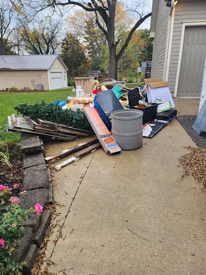 Dumpster being loaded with debris for Commercial Dumpster Rental in Lake Wylie